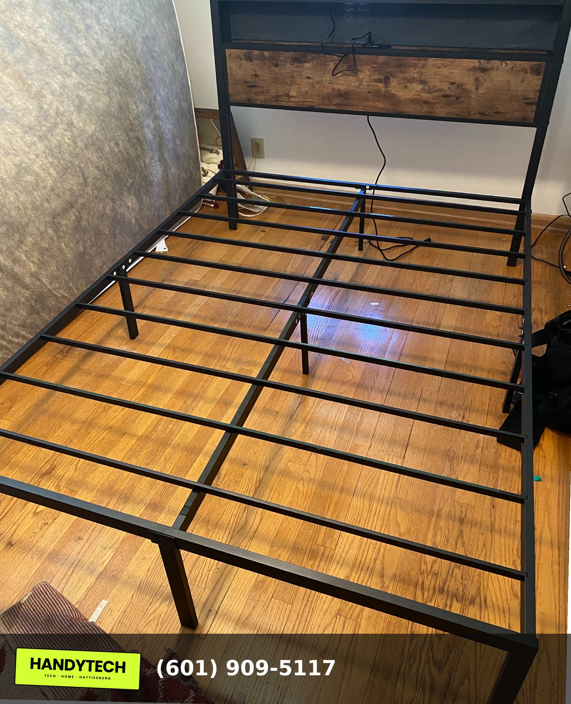Bed frame with LED lighting assembled in a Hattiesburg MS bedroom by HandyTech
