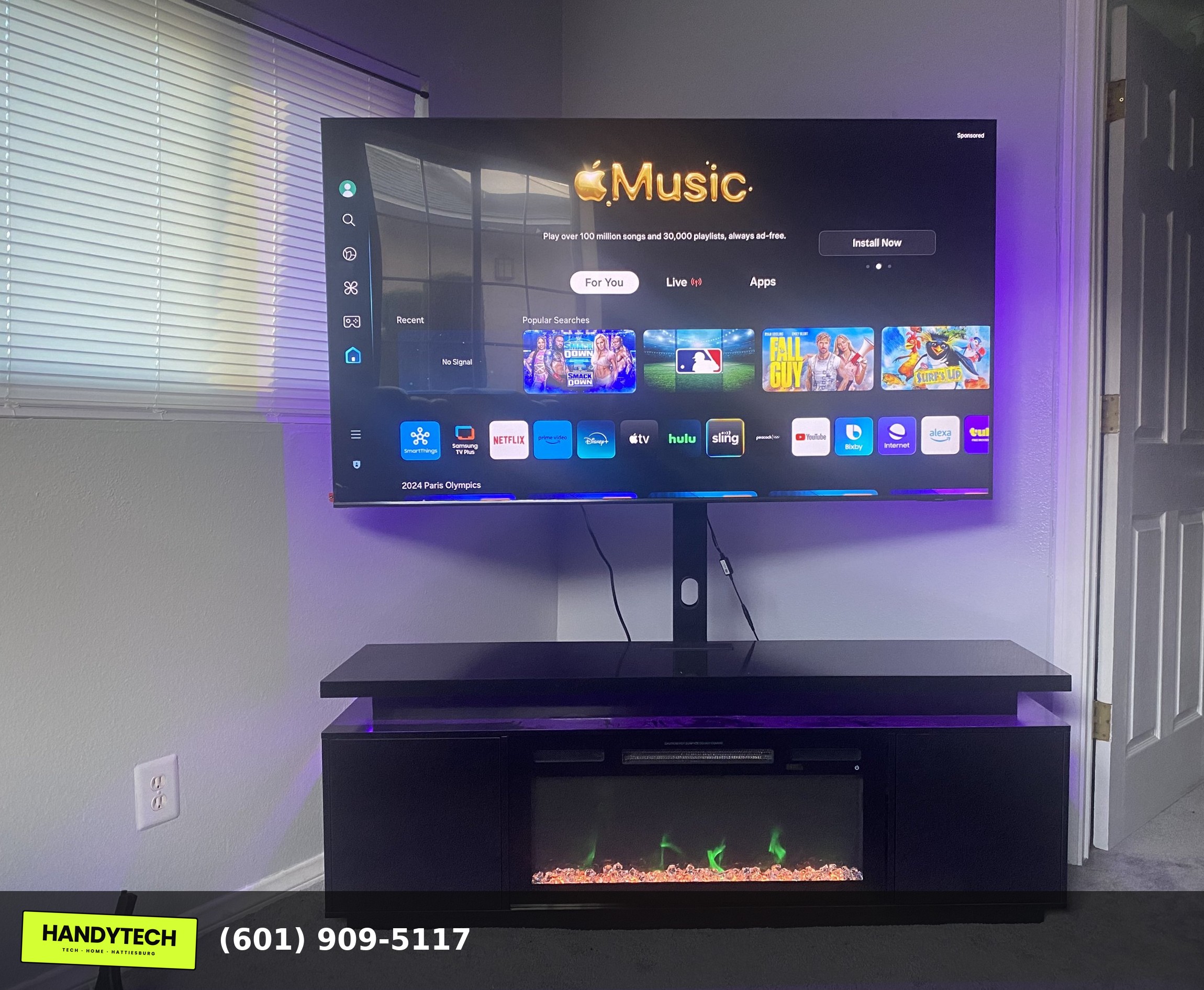 Media console assembled under a mounted TV in Hattiesburg MS